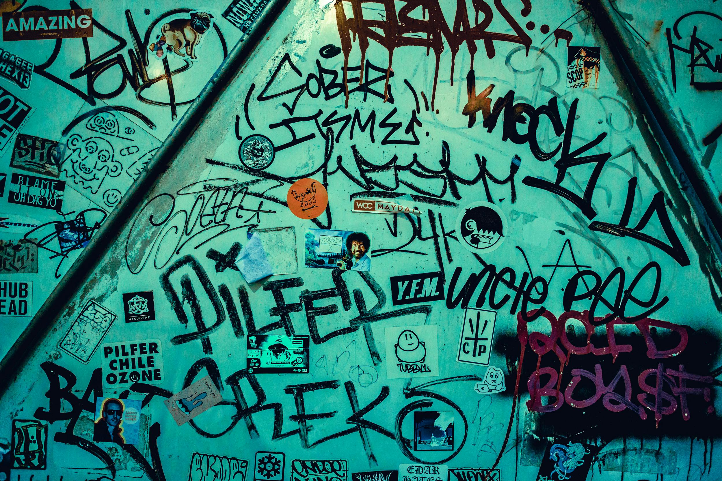 Dynamic graffiti art on an urban wall in Tokyo, Japan, showcasing street creativity.