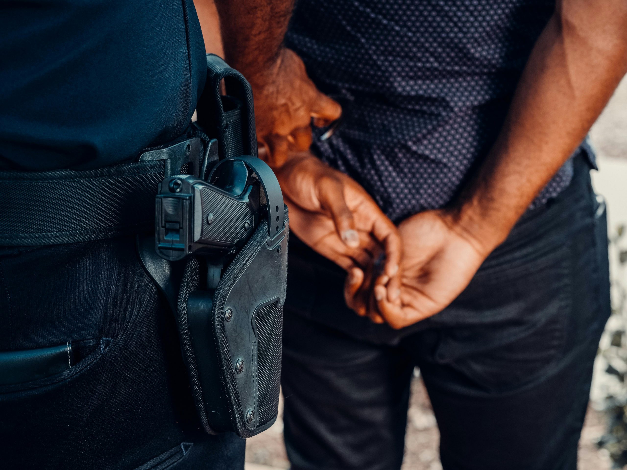 Hand holding stun gun representing California Penal Code 244.5 PC assault charges under California stun gun laws.