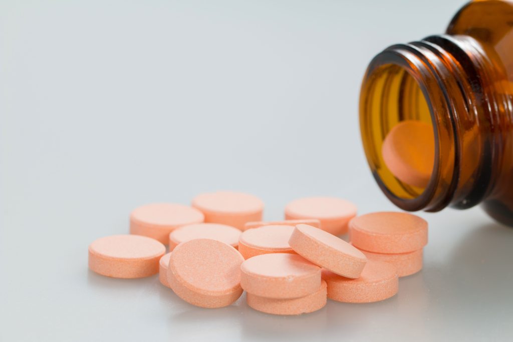 Adderall pills and prescription bottle in a California drug possession case